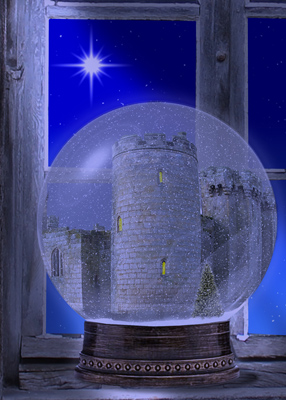 Castle in Snow globe sitting on window beneath a shiny star