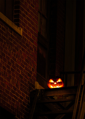 Jack-o-lantern on a fire-escape.
