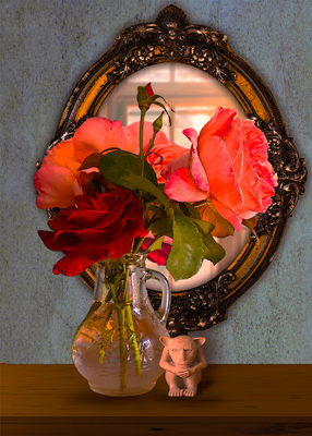 Red and pink roses reflected in an ornate mirror.