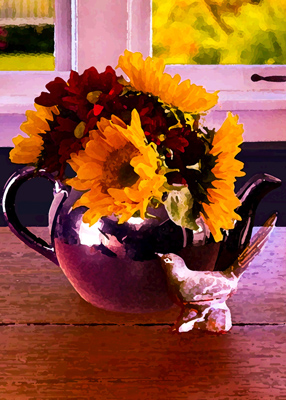 A small bird statuette sits next to a blue teapot filled with sunflowers.